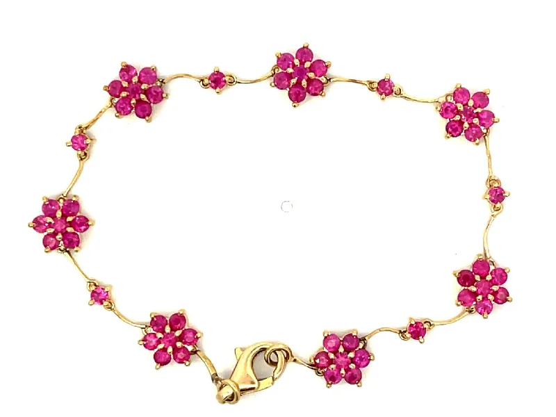 Ladies bracelets for globetrotters -Ruby Flower Bracelet in 18k Yellow Gold