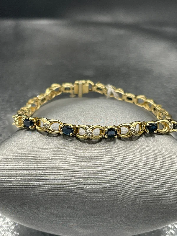 Ladies bracelets radiant finish -14 Karat Yellow Gold Sapphire And Diamond Bracelet